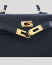 Hermès Mini Kelly 20 — Noir Chevre Leather, Gold Hardware